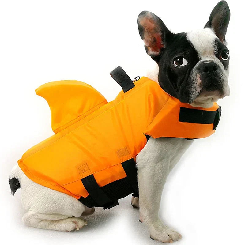 "Dog life jacket with shark fin, vibrant colors, adjustable straps, ensures pet safety and buoyancy in water adventures."