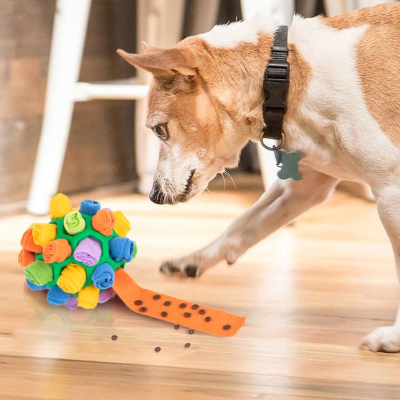 Dog's interactive snuffle treat ball in blue, green, and red, made of plush fleece and durable rubber for engaging playtime.