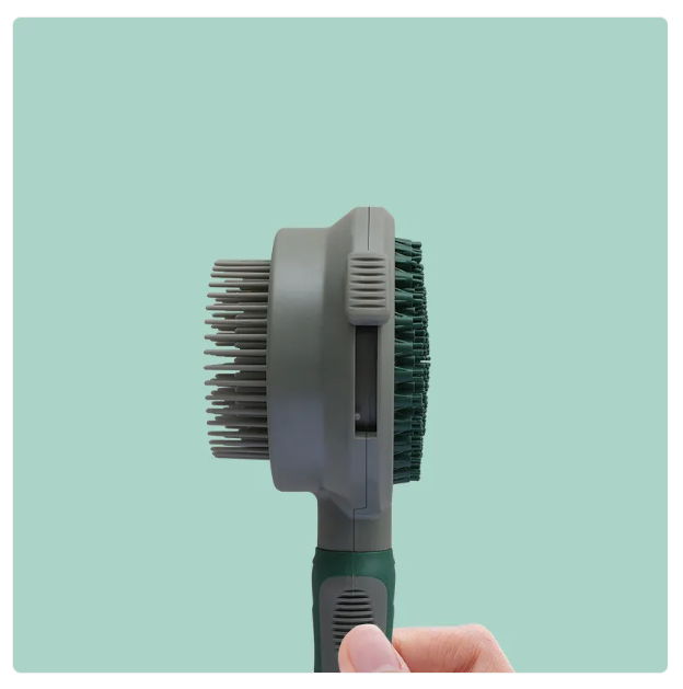 Double-sided cat grooming brush with soft, gentle bristles for long and medium fur; ergonomic handle for easy pet care.