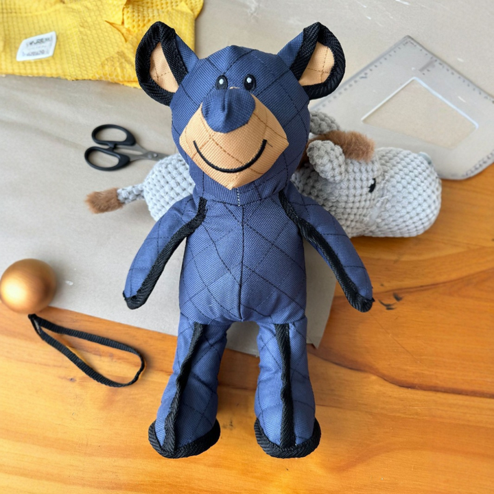 "Durable plush dog teddy in soft beige fabric, ideal for pet playtime and comfort. Perfect for chewing and cuddling."