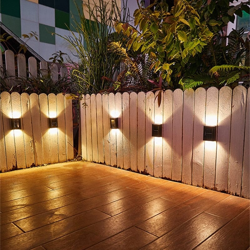 Eco-friendly outdoor solar wall light with modern design, emits warm glow, weather-resistant for gardens and patios.