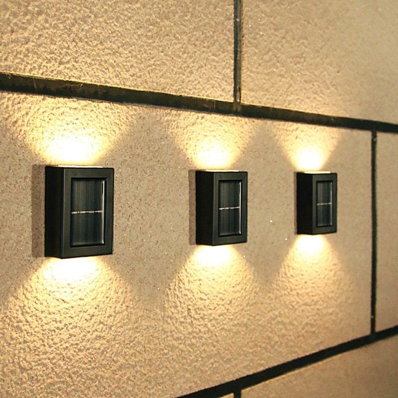 Eco-friendly outdoor solar wall light with modern design, emits warm glow, weather-resistant for gardens and patios.