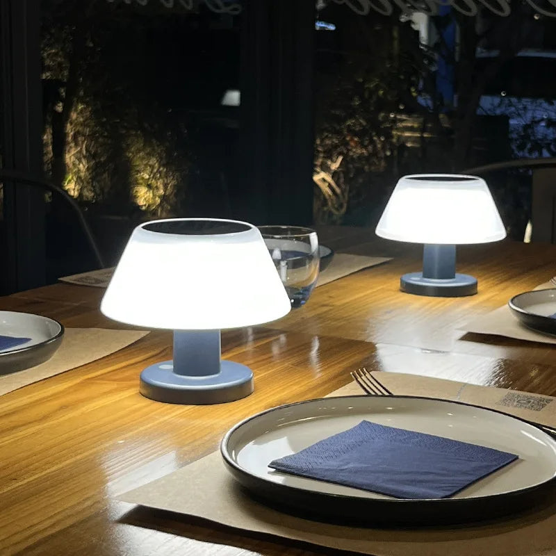 Eco-friendly solar-powered LED table lamp with sleek modern design for indoor and outdoor use; durable and waterproof.