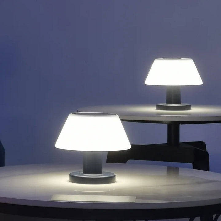 Eco-friendly solar-powered LED table lamp with sleek modern design for indoor and outdoor use; durable and waterproof.