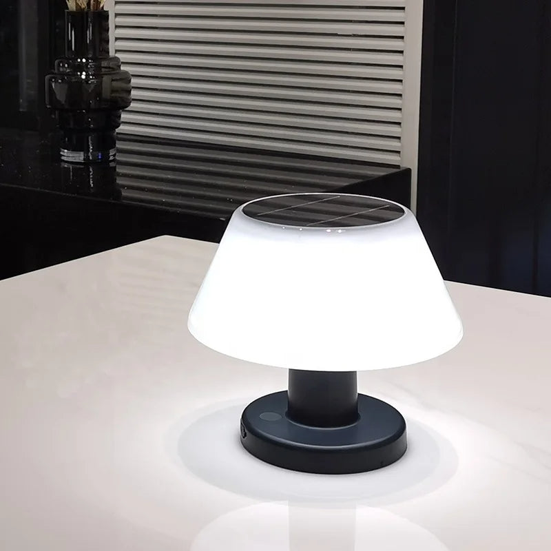 Eco-friendly solar-powered LED table lamp with sleek modern design for indoor and outdoor use; durable and waterproof.