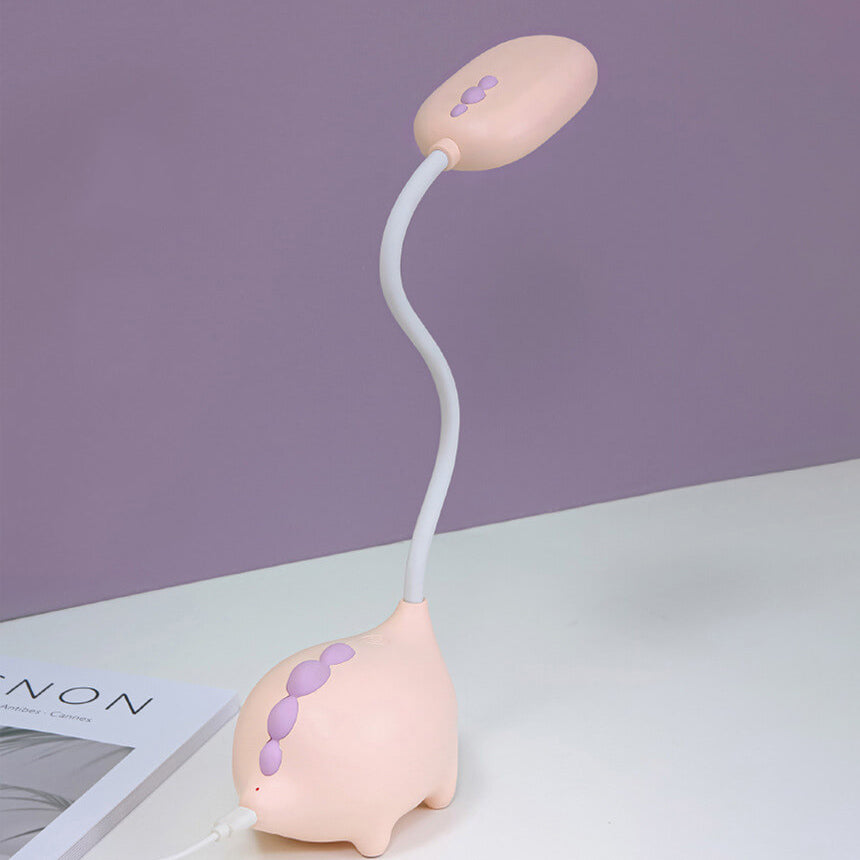 Eco-friendly T-Rex LED desk light for kids; whimsical dino shape, adjustable neck, soft eye-caring light; available in yellow