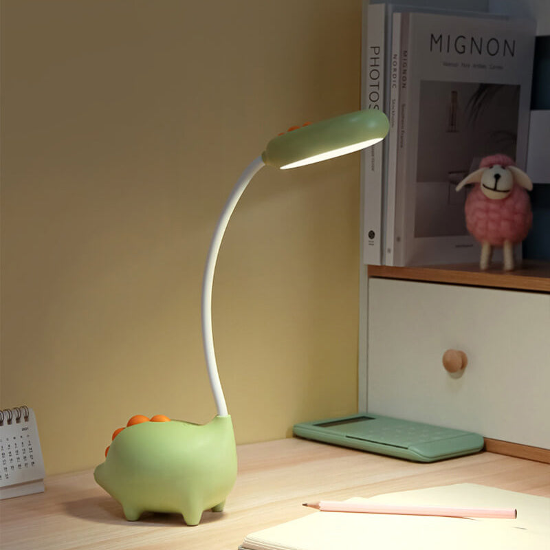Eco-friendly T-Rex LED desk light for kids; whimsical dino shape, adjustable neck, soft eye-caring light; available in yellow