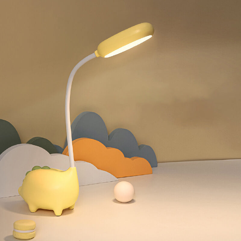 Eco-friendly T-Rex LED desk light for kids; whimsical dino shape, adjustable neck, soft eye-caring light; available in yellow
