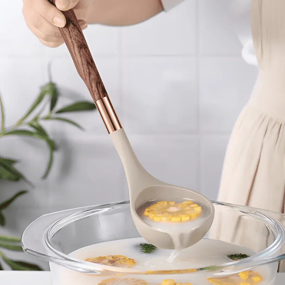 Elegant 10-piece silicone utensil set, heat resistant, features ergonomic handles, minimalist design for modern kitchens.