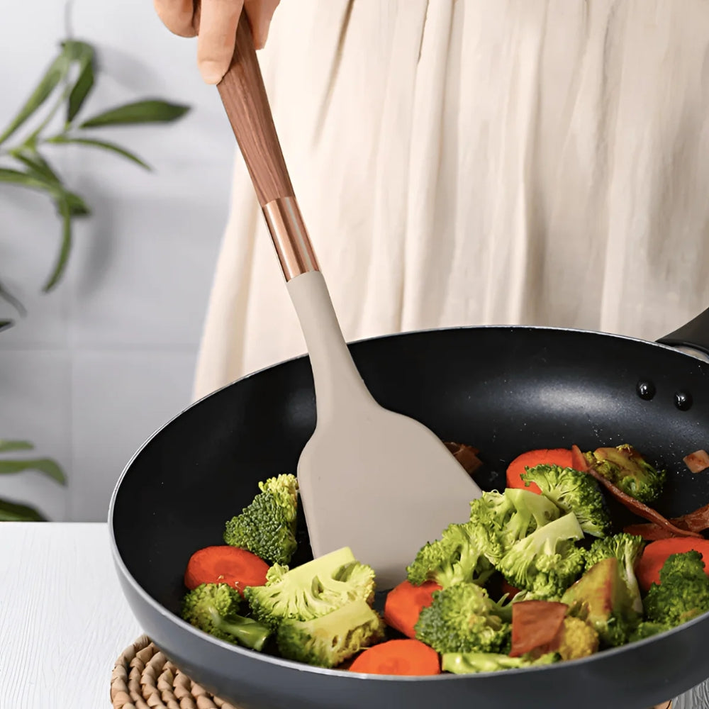 Elegant 10-piece silicone utensil set, heat resistant, features ergonomic handles, minimalist design for modern kitchens.