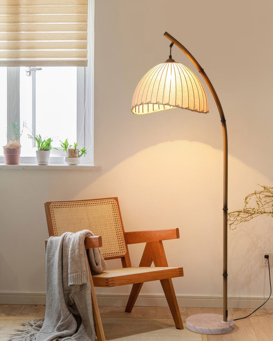 Elegant bamboo floor lamp with fabric shade, offering ambient lighting for a relaxing ambiance in home decor settings.