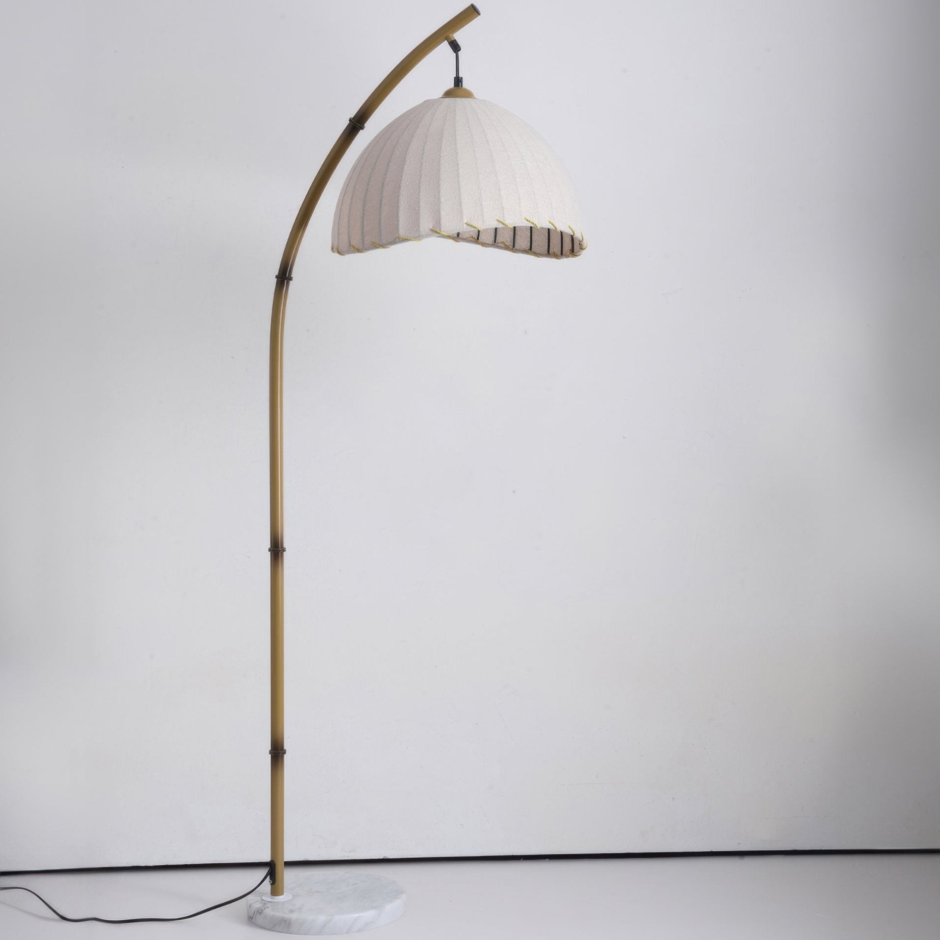 Elegant bamboo floor lamp with fabric shade, offering ambient lighting for a relaxing ambiance in home decor settings.