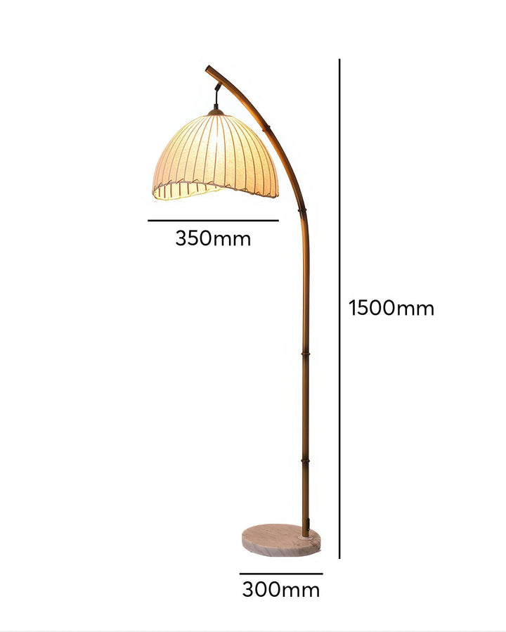 Elegant bamboo floor lamp with fabric shade, offering ambient lighting for a relaxing ambiance in home decor settings.