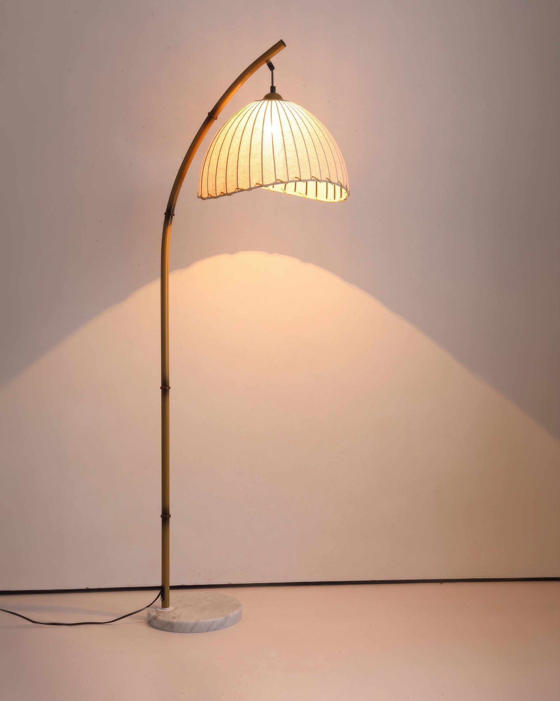 Elegant bamboo floor lamp with fabric shade, offering ambient lighting for a relaxing ambiance in home decor settings.