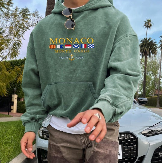 Elegant blue Monte Carlo men's hoodie with embroidery, featuring a refined relaxed fit, perfect for versatile casual style.