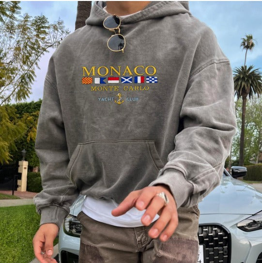 Elegant blue Monte Carlo men's hoodie with embroidery, featuring a refined relaxed fit, perfect for versatile casual style.