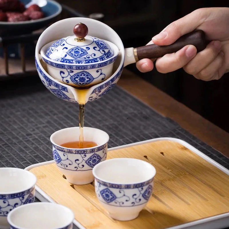 "Elegant ceramic rotating Japanese tea pot set with infuser, showcasing handcrafted artistry and traditional design in blue."