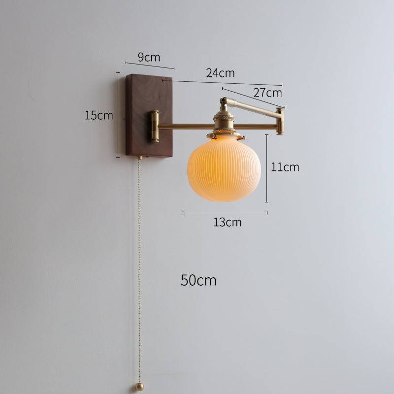 "Elegant ceramic wall lamp with wooden plate, featuring a modern design in cylinder or globe lampshade for stylish interiors.