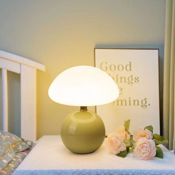 "Elegant French cream mushroom table lamp with adjustable LED colors, inspired by whimsical design and Bauhaus style."