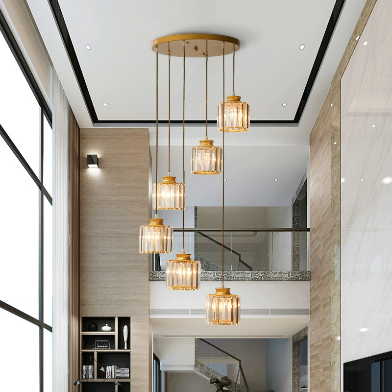 "Elegant gold and black crystal chandelier with cascading crystals, perfect for staircases and grand entryways, luxurious lig