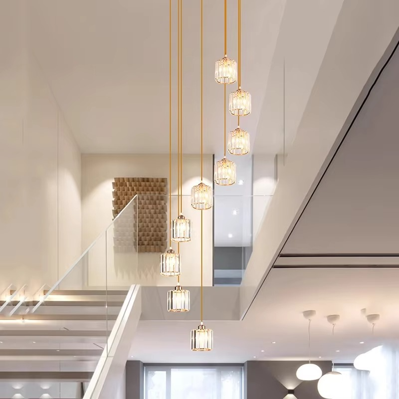 "Elegant gold and black crystal chandelier with cascading crystals, perfect for staircases and grand entryways, luxurious lig