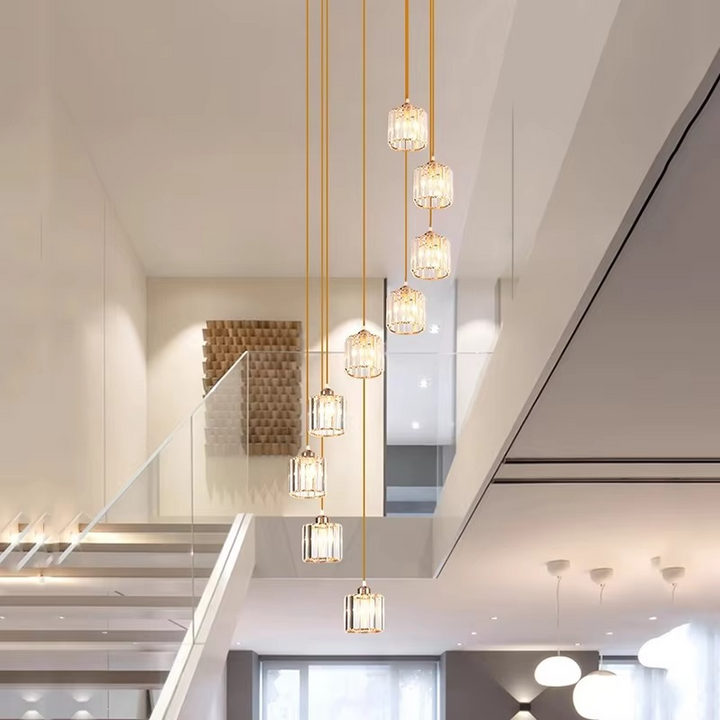 "Elegant gold and black crystal chandelier with cascading crystals, perfect for staircases and grand entryways, luxurious lig