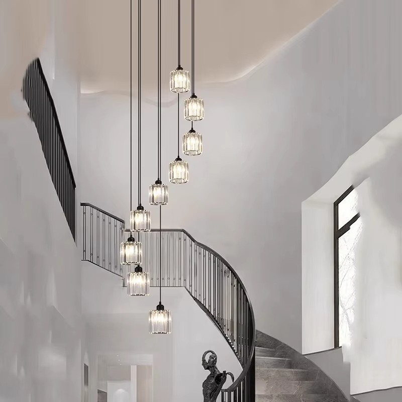 "Elegant gold and black crystal chandelier with cascading crystals, perfect for staircases and grand entryways, luxurious lig