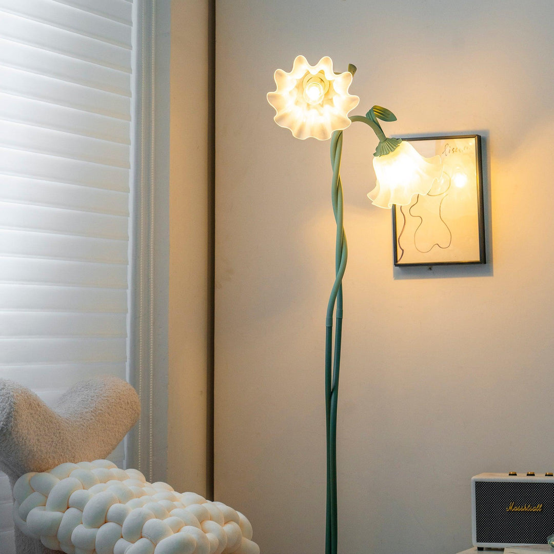 Elegant green floor lamp with white calla flower accents, matte finish, and metal construction, enhancing home decor.