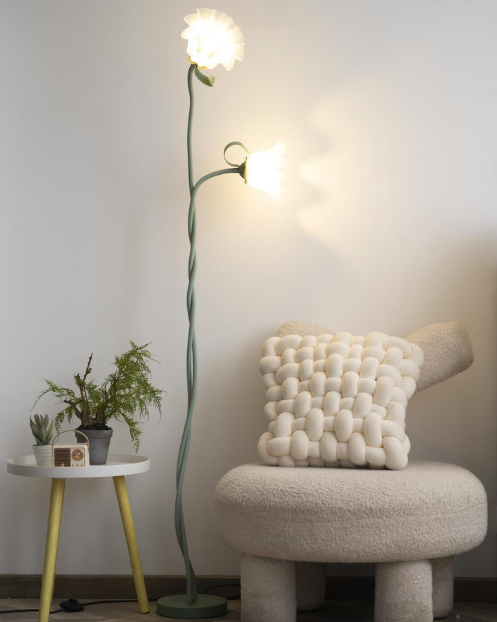 Elegant green floor lamp with white calla flower accents, matte finish, and metal construction, enhancing home decor.