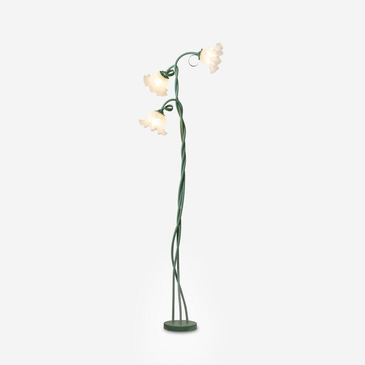 Elegant green floor lamp with white calla flower accents, matte finish, and metal construction, enhancing home decor.