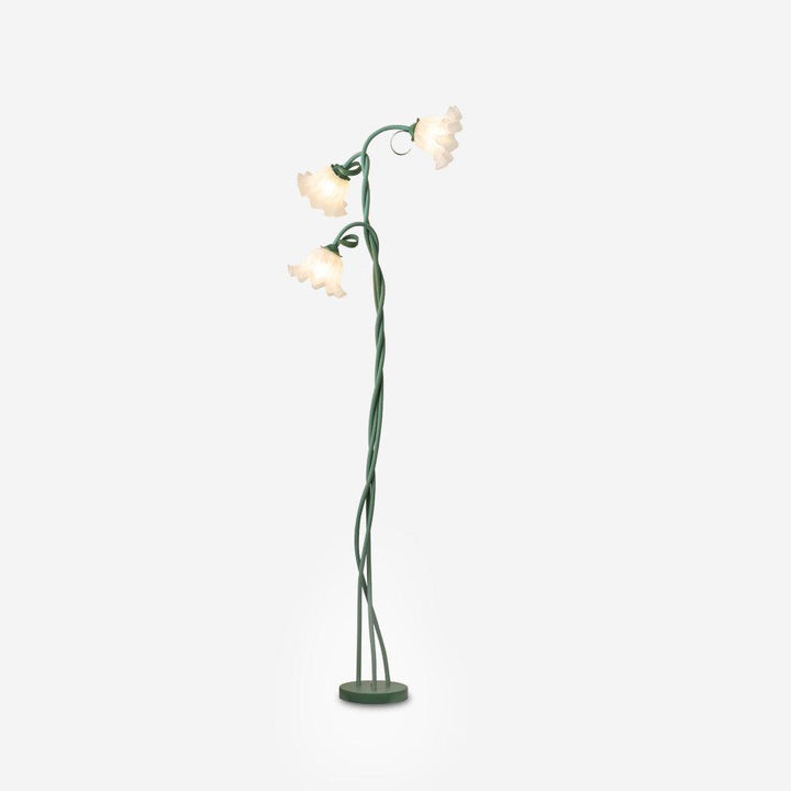 Elegant green floor lamp with white calla flower accents, matte finish, and metal construction, enhancing home decor.