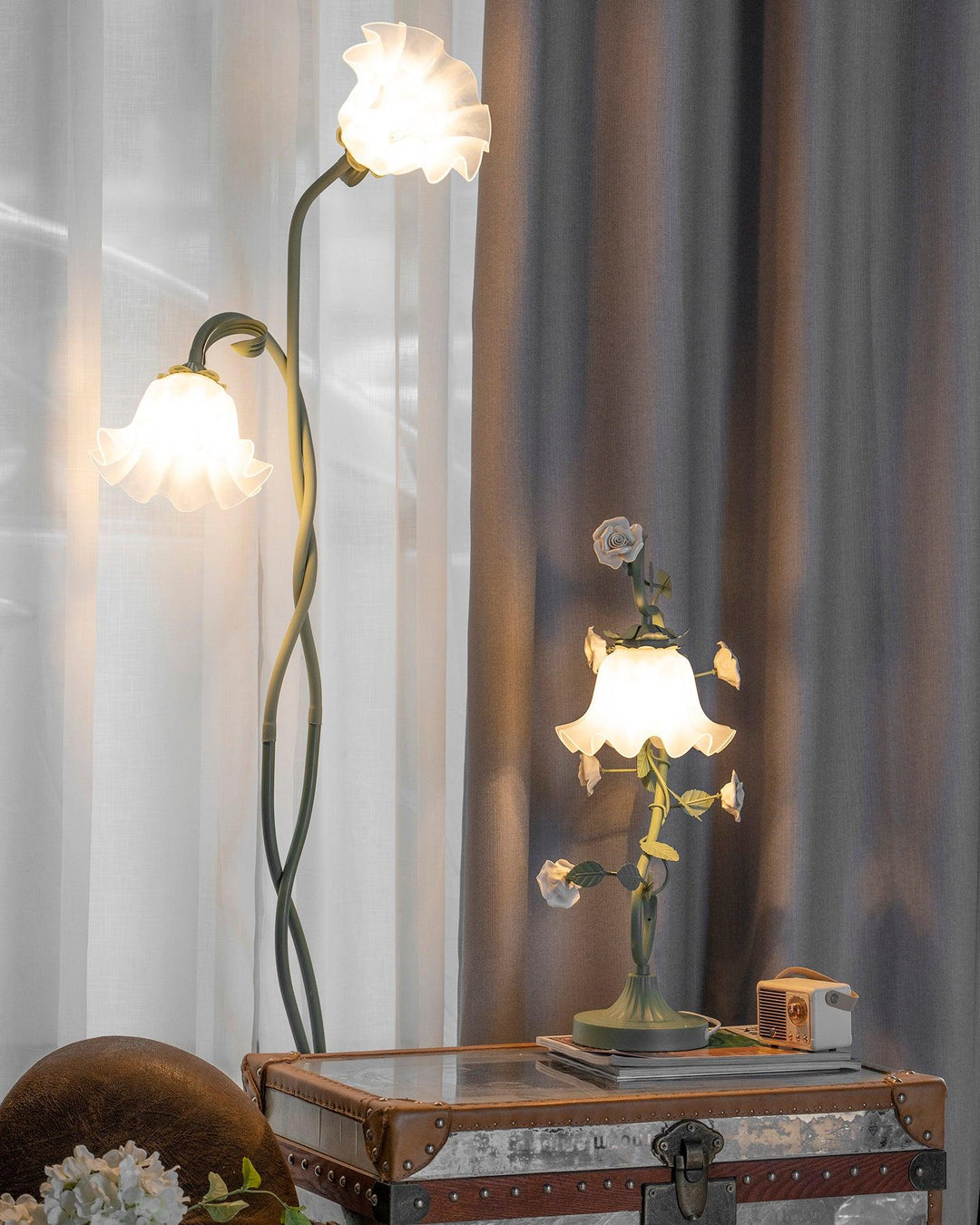 Elegant green floor lamp with white calla flower accents, matte finish, and metal construction, enhancing home decor.