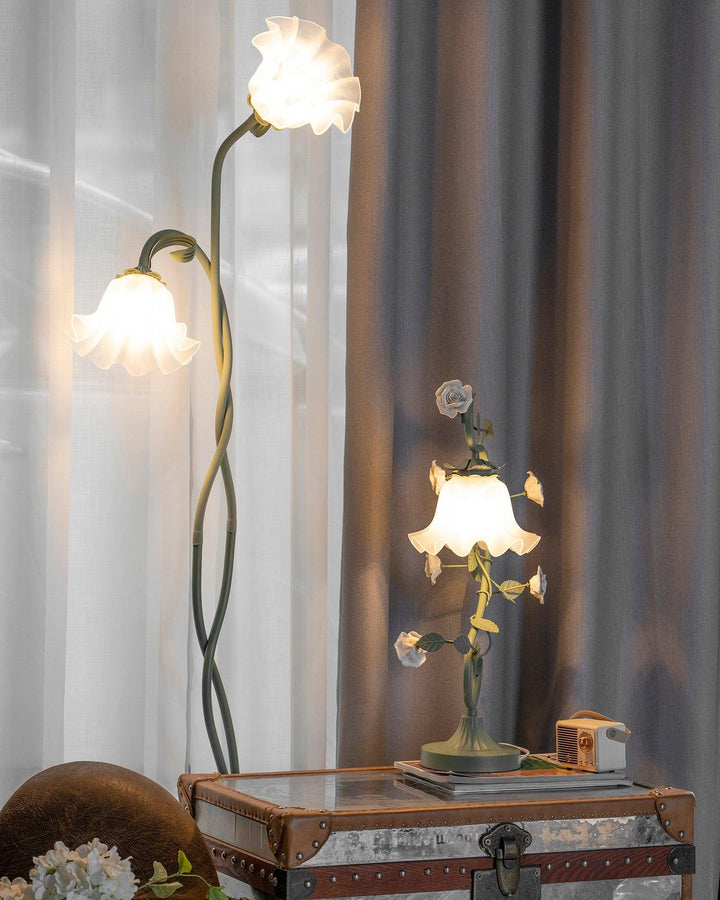 Elegant green floor lamp with white calla flower accents, matte finish, and metal construction, enhancing home decor.