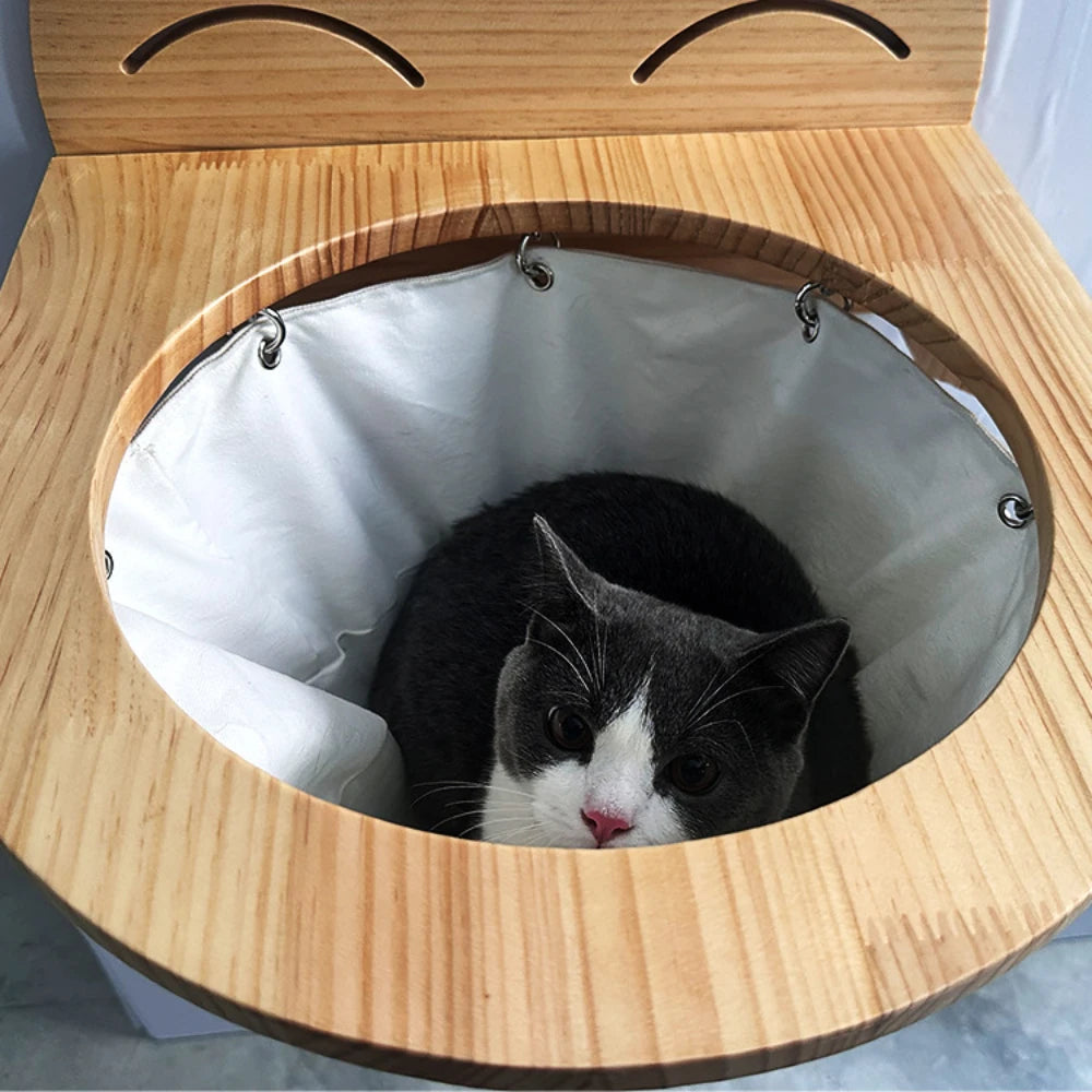 "Elegant hanging wooden cat basket, elevated perch, modern home décor, stylish pet supplies, cozy wooden hammock."