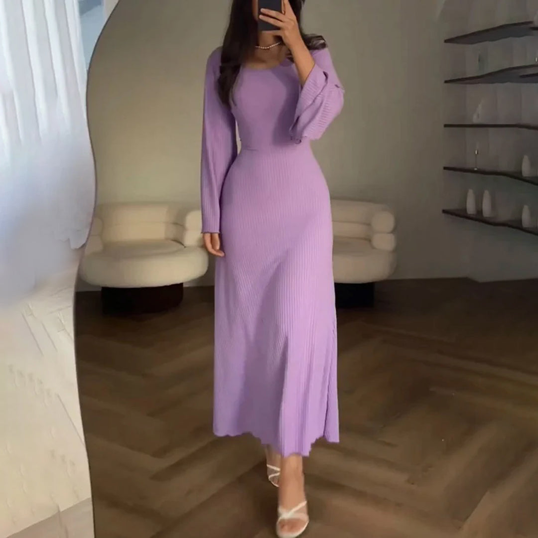 Elegant knit maxi dress with long sleeves in solid brown, featuring a round neckline and wide sleeves for a chic look.