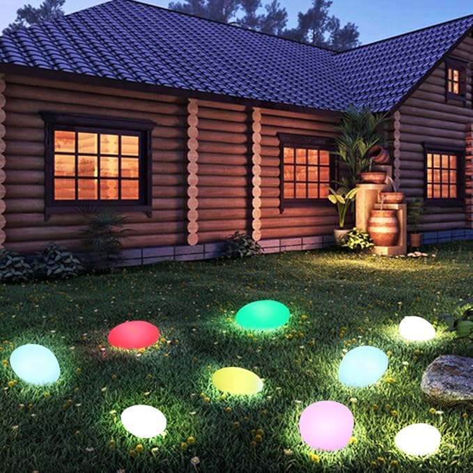 Elegant LED garden light with cobblestone design, glowing in multiple colors, ideal for illuminating outdoor spaces like gard