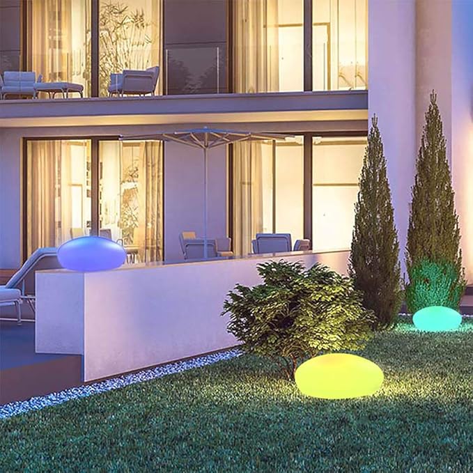 Elegant LED garden light with cobblestone design, glowing in multiple colors, ideal for illuminating outdoor spaces like gard