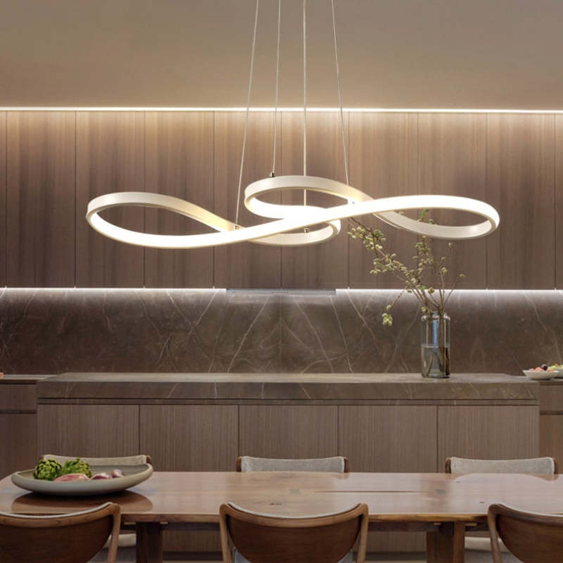 "Elegant LED pendant lamp with musical notes design in metallic black, white, and gold, creating a contemporary aesthetic."
