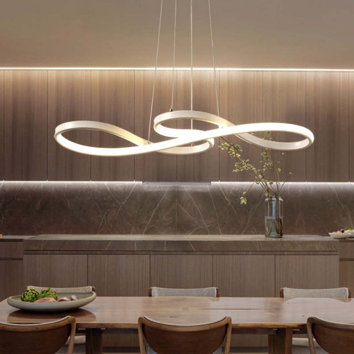 "Elegant LED pendant lamp with musical notes design in metallic black, white, and gold, creating a contemporary aesthetic."