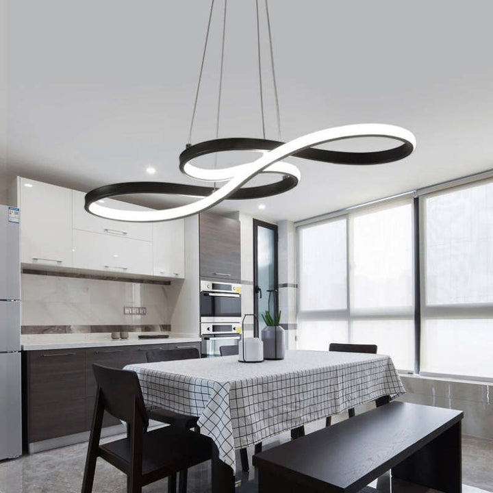 "Elegant LED pendant lamp with musical notes design in metallic black, white, and gold, creating a contemporary aesthetic."