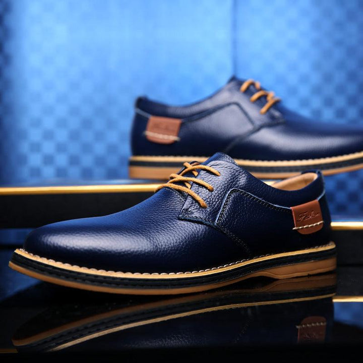 "Elegant men's premium leather Oxford dress shoes, classic formal wear with polished look, ideal for business attire."