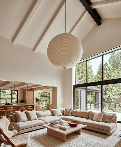 "Elegant modern Japanese paper lantern pendant light with a warm glow, blending contemporary and mid-century design."