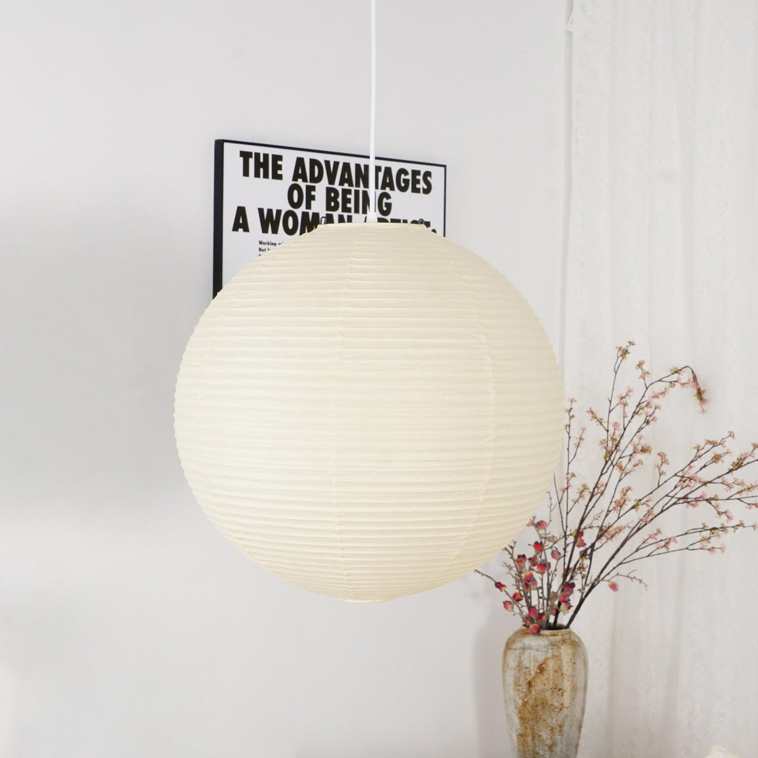 "Elegant modern Japanese paper lantern pendant light with a warm glow, blending contemporary and mid-century design."