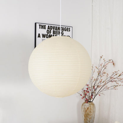 "Elegant modern Japanese paper lantern pendant light with a warm glow, blending contemporary and mid-century design."