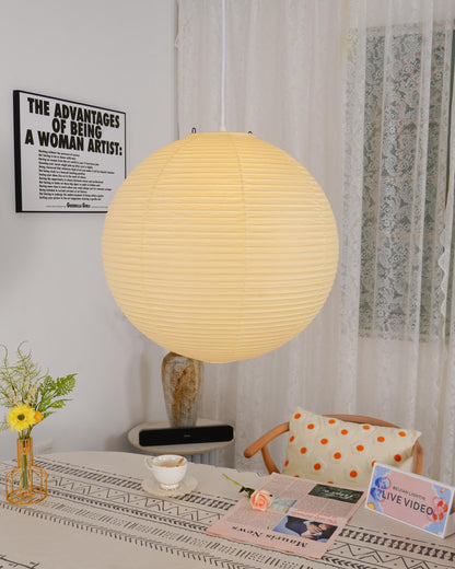 "Elegant modern Japanese paper lantern pendant light with a warm glow, blending contemporary and mid-century design."