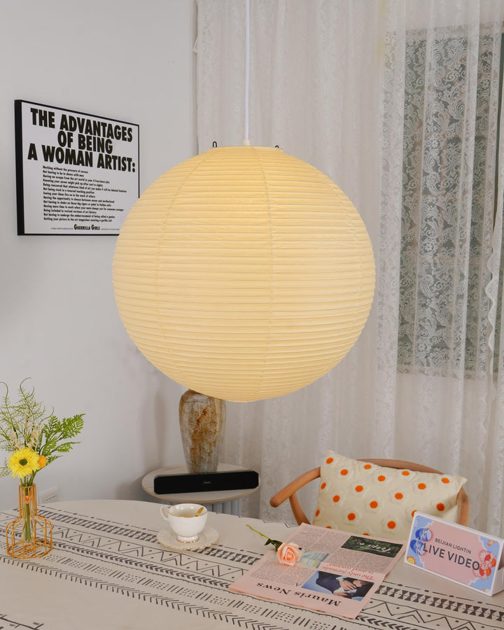 "Elegant modern Japanese paper lantern pendant light with a warm glow, blending contemporary and mid-century design."