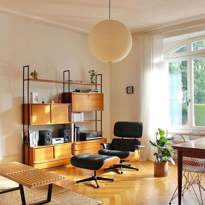 "Elegant modern Japanese paper lantern pendant light with a warm glow, blending contemporary and mid-century design."