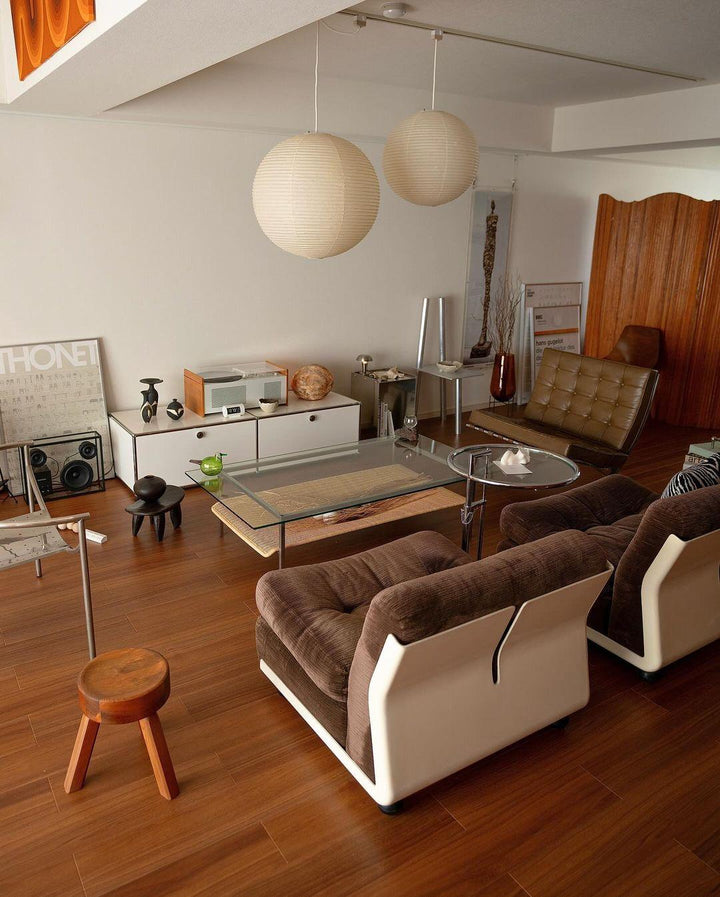 "Elegant modern Japanese paper lantern pendant light with a warm glow, blending contemporary and mid-century design."