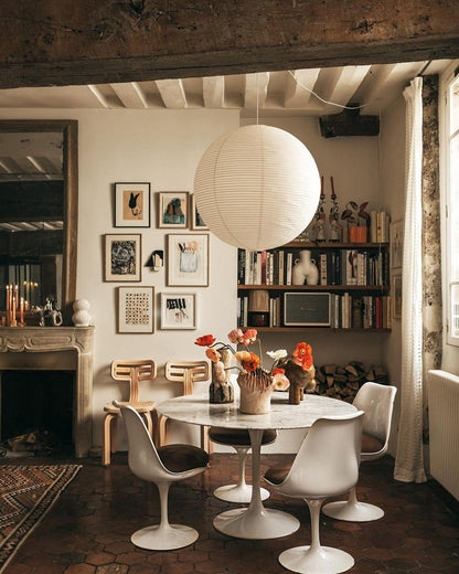 "Elegant modern Japanese paper lantern pendant light with a warm glow, blending contemporary and mid-century design."