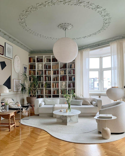"Elegant modern Japanese paper lantern pendant light with a warm glow, blending contemporary and mid-century design."